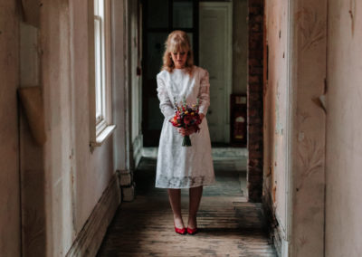 Portrait of bride standing in hallway at Victoria Baths in Manchester